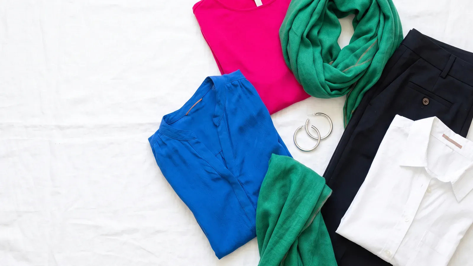 Bright Winter colors: clothes laid flat in the Bright Winter palette