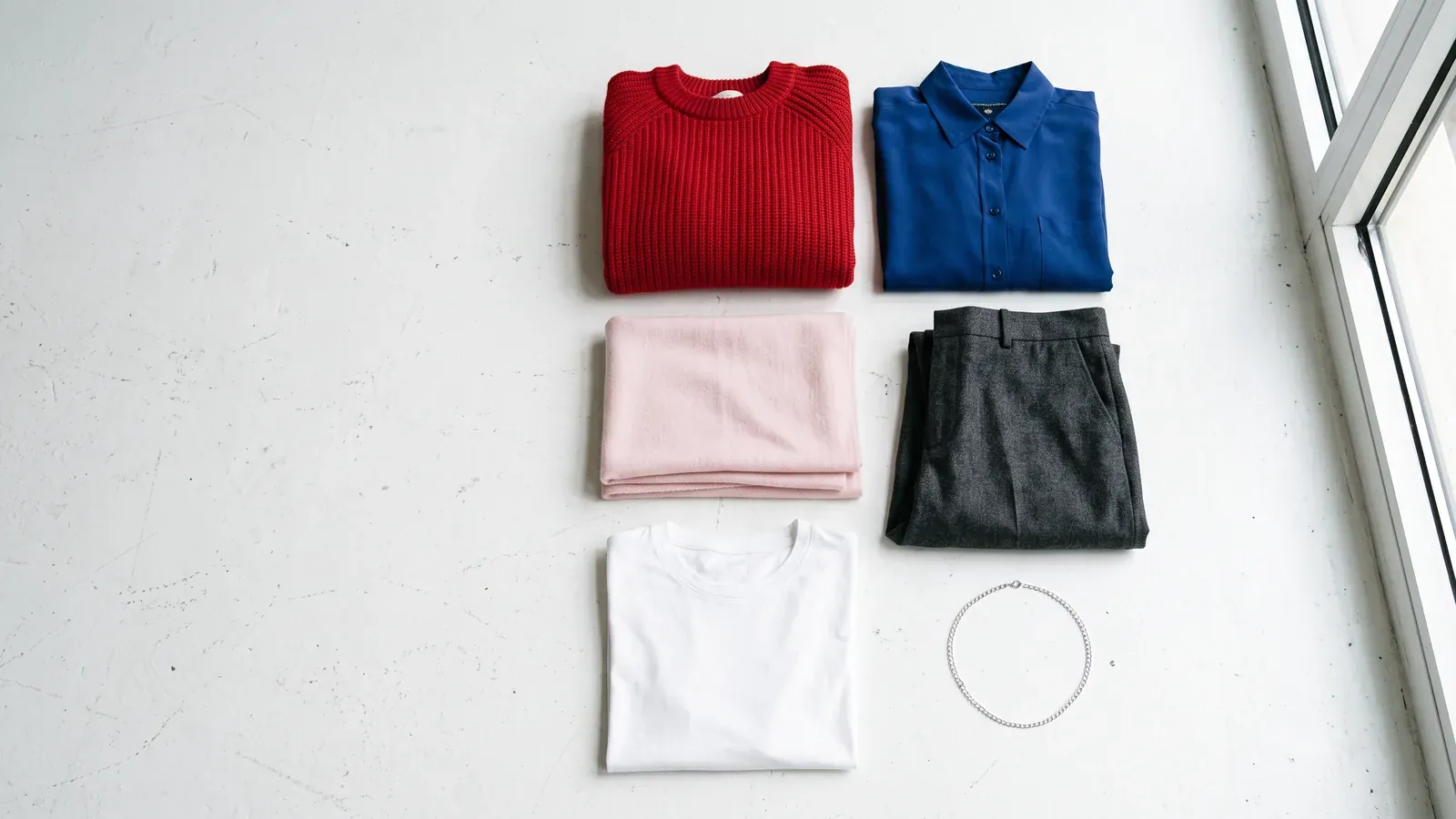 Cool Winter colors: clothes laid flat in the Cool Winter palette